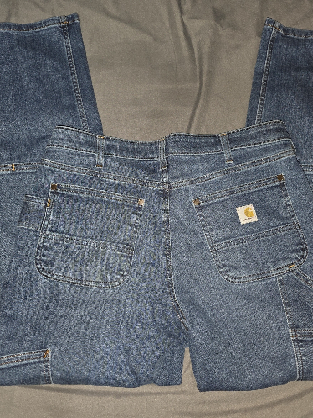 Carhartt Medium Blue Denim Work Jeans with Back Pocket Patch